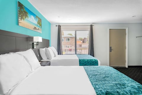 Deluxe Room, 2 Queen Beds, Non Smoking | Desk, blackout drapes, soundproofing, iron/ironing board