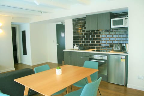 One Bedroom Suite | Private kitchen | Fridge, microwave