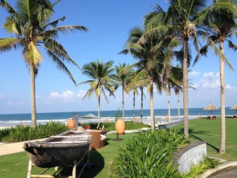 On the beach, white sand, sun loungers, beach umbrellas