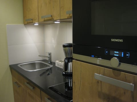 Apartment, 2 Bedrooms | Private kitchen | Full-size fridge, microwave, stovetop, coffee/tea maker