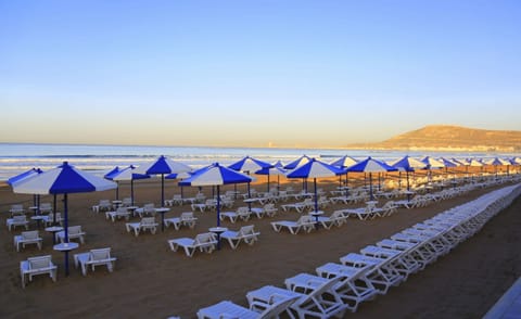 On the beach, sun loungers, beach umbrellas