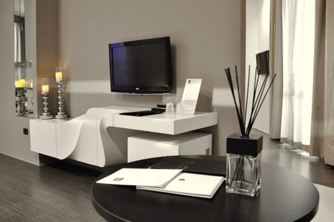 Luxury Suite, 1 Bedroom, Balcony | Living area | Flat-screen TV, first-run movies