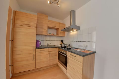 Apartment (4 House 33a) | Private kitchen | Fridge, microwave, oven, stovetop
