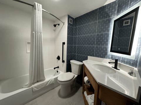 Premium bedding, desk, blackout drapes, iron/ironing board