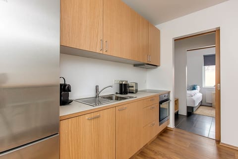 Deluxe Apartment, 2 Bedrooms, Balcony | Private kitchen | Full-size fridge, oven, stovetop, dishwasher