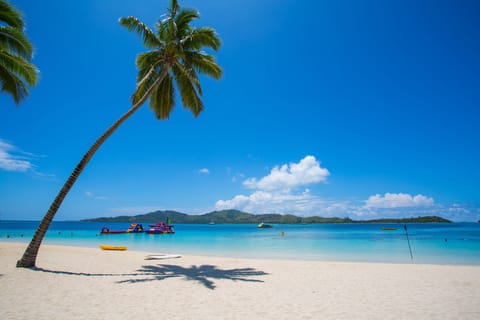 Private beach, white sand, sun loungers, beach umbrellas