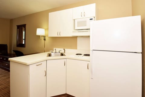 Fridge, microwave, stovetop, coffee/tea maker