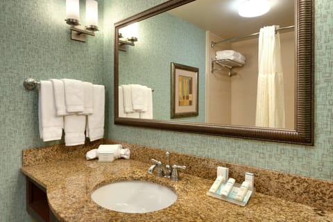 Combined shower/tub, designer toiletries, hair dryer, towels