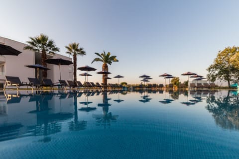 2 outdoor pools, open 11:00 AM to 8:00 PM, pool umbrellas, sun loungers