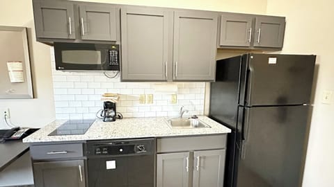 Studio Suite, 1 King Bed, Accessible (Comms, Mobility, Access Tub) | Private kitchen | Full-size fridge, microwave, stovetop, dishwasher