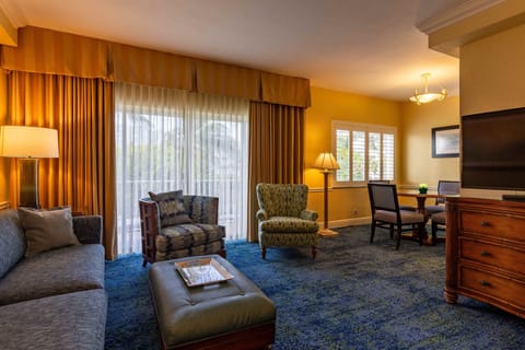 Deluxe Suite | Living area | 49-inch flat-screen TV with satellite channels, TV, foosball