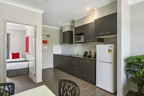 Deluxe Two Bedroom Apartment | Private kitchen | Fridge, coffee/tea maker, electric kettle