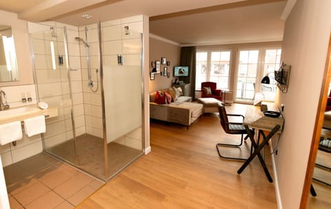 Deluxe Double Room, Balcony | Bathroom | Shower, eco-friendly toiletries, hair dryer, bathrobes