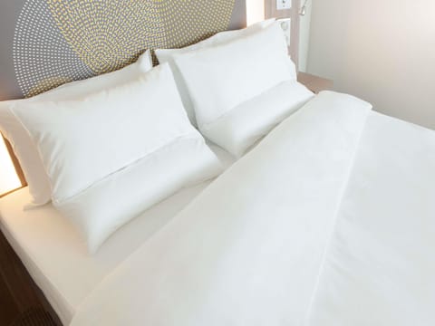 Premium bedding, memory foam beds, in-room safe, desk