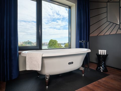 Suite | Bathroom | Designer toiletries, hair dryer, slippers, towels