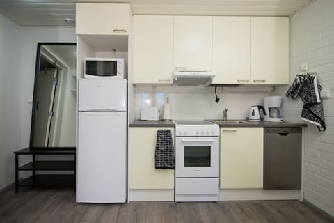 Family Apartment, 2 Bedrooms | Private kitchen | Fridge, microwave, stovetop, coffee/tea maker