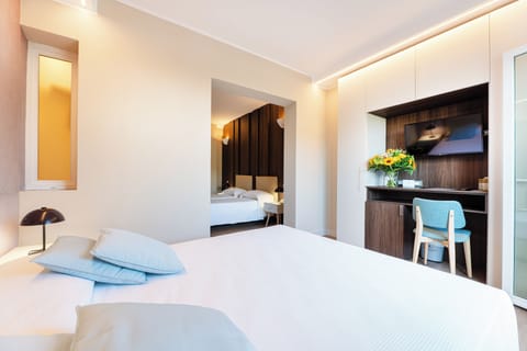 Family Quadruple Room | Minibar, in-room safe, desk, free WiFi