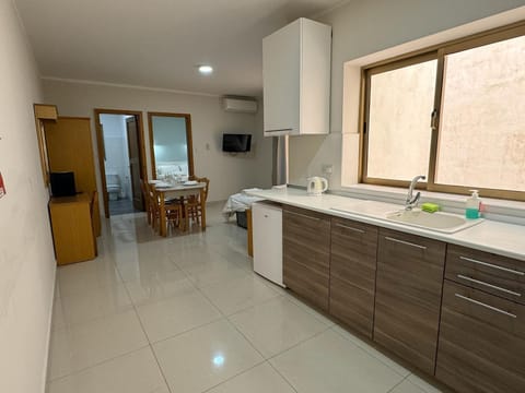 Condo, 2 Bedrooms (2 Bed Sleeps 5) | Desk, iron/ironing board, free cribs/infant beds, rollaway beds