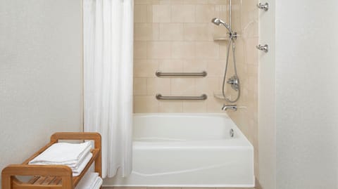 Combined shower/tub, designer toiletries, hair dryer, towels