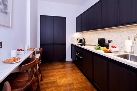 Deluxe One Bedroom Apartment | Private kitchen | Full-size fridge, microwave, oven, stovetop