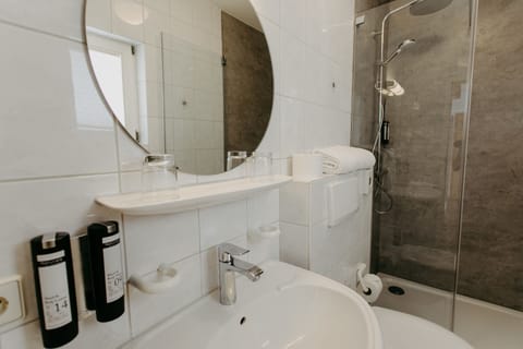 Standard Double Room | Bathroom | Shower, hair dryer, towels, soap