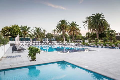 Indoor pool, outdoor pool, pool umbrellas, sun loungers