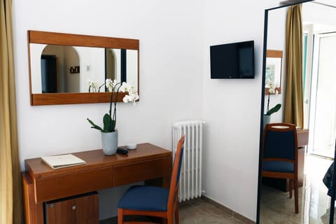 Standard Double Room | Minibar, in-room safe, desk, blackout drapes