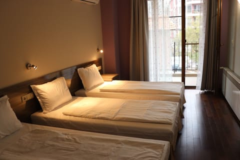 Comfort Triple Room, Non Smoking, City View | Premium bedding, desk, laptop workspace, blackout drapes