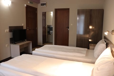 Comfort Triple Room, Non Smoking, City View | Premium bedding, desk, laptop workspace, blackout drapes