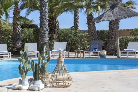 Outdoor pool, open 9 AM to 7:30 PM, pool umbrellas, sun loungers