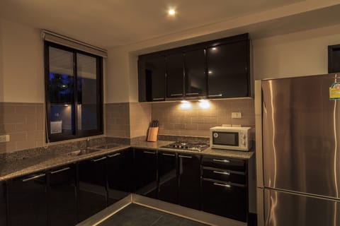 2-Bedroom Pool View Apartment | Private kitchen | Fridge, microwave, stovetop, coffee/tea maker