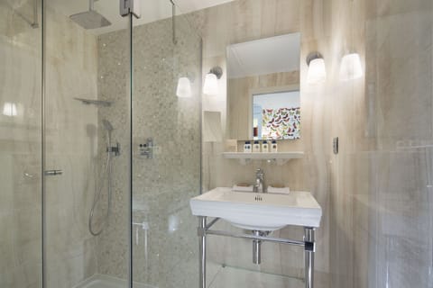 Deluxe Double Room | Bathroom | Rainfall showerhead, designer toiletries, hair dryer, towels