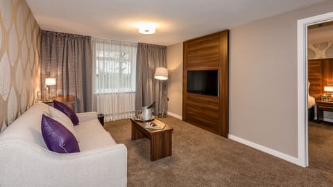 Luxury Suite | Premium bedding, iron/ironing board, free WiFi, bed sheets