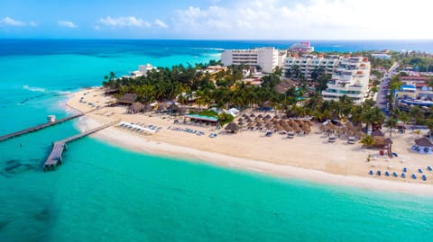 On the beach, white sand, sun loungers, beach umbrellas