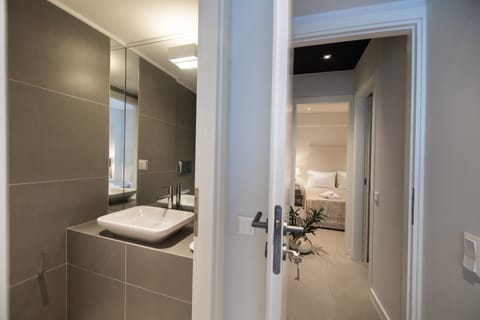 Suite, Pool View | Bathroom | Shower, free toiletries, hair dryer, bathrobes