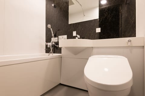 Twin Room | Bathroom | Free toiletries, hair dryer, slippers, electronic bidet