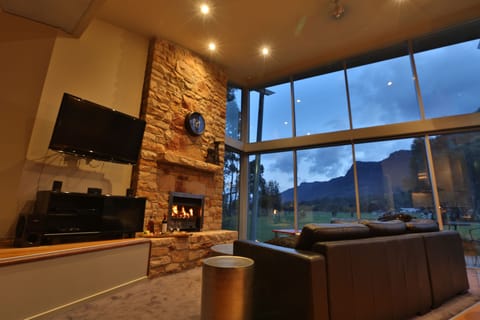 Luxury Chalet (Bushland Luxury Couples Retreat) | Living area | Flat-screen TV, fireplace, DVD player