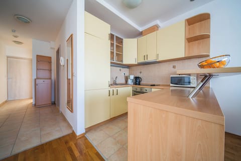 Apartment, 2 Bedrooms, Balcony | Private kitchen | Full-size fridge, microwave, stovetop, dishwasher