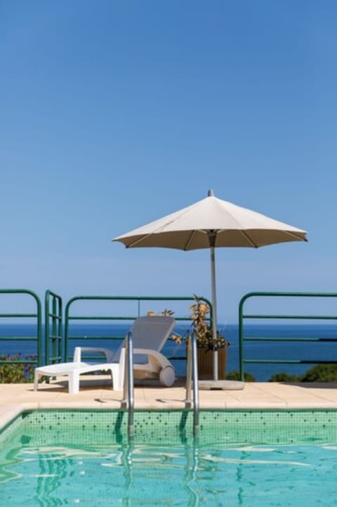 Seasonal outdoor pool, pool umbrellas, sun loungers