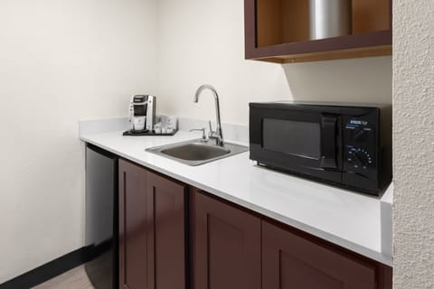 Premium bedding, desk, laptop workspace, iron/ironing board