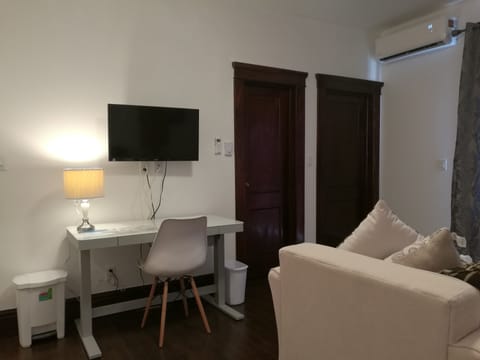 Luxury Suite, 1 King Bed, Balcony | Living room | 32-inch LED TV with satellite channels, TV, Netflix