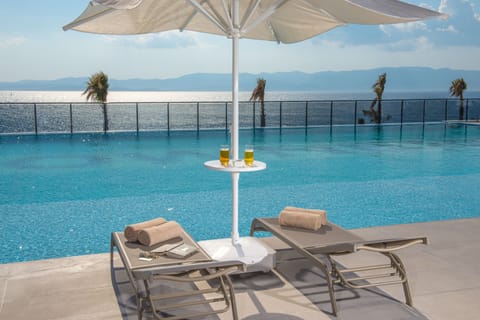 Outdoor pool, pool umbrellas, sun loungers