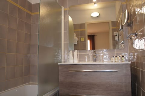 Comfort Room | Bathroom | Designer toiletries, hair dryer, slippers, towels