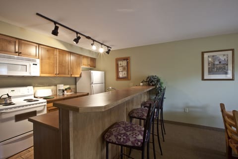 Suite, 1 Bedroom | Private kitchen | Fridge, coffee/tea maker, electric kettle