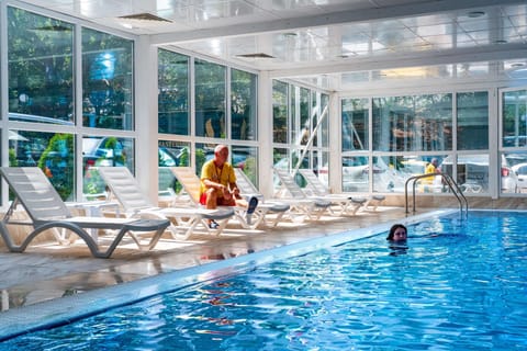 Indoor pool, seasonal outdoor pool, pool umbrellas, sun loungers