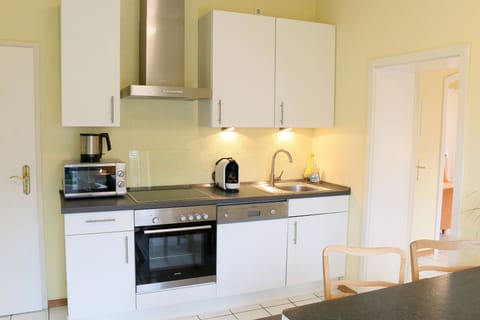 Apartment 1 with cathedral view & balcony | Private kitchen | Full-size fridge, microwave, oven, stovetop