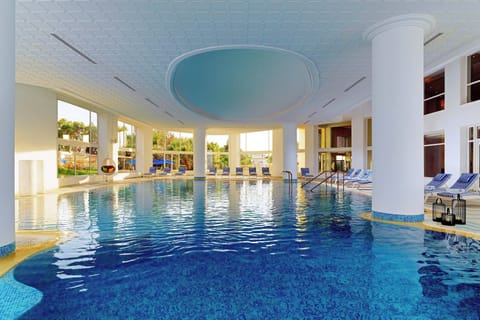 Indoor pool, seasonal outdoor pool, pool umbrellas, sun loungers