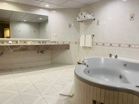 Luxury Suite, 1 Bedroom, Private Bathroom (Master) | Bathroom | Free toiletries, hair dryer, towels, soap