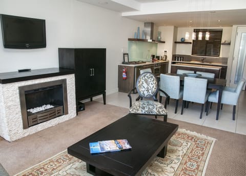 Luxury Suite - One Bedroom | Living area | Plasma TV, fireplace, DVD player