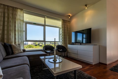 Luxury Apartment, 1 Bedroom, River View, Oceanfront | Living area | Flat-screen TV, pay movies